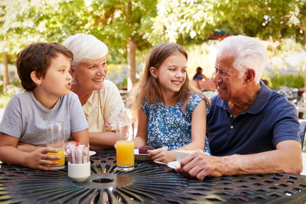 Grandparents Laughing with Their Grandchildren