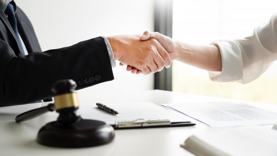 Lawyer Shaking Hands With His Client